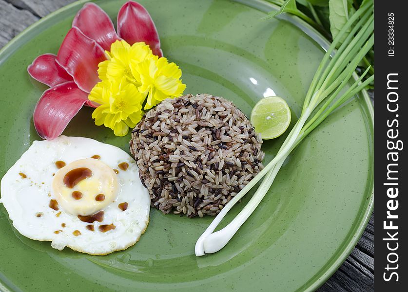 Organic jasmine rice whit fried egg on green dish. Organic jasmine rice whit fried egg on green dish.