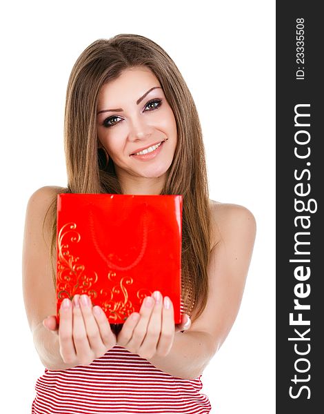 Beautiful young woman with a gift in her hands. Beautiful young woman with a gift in her hands