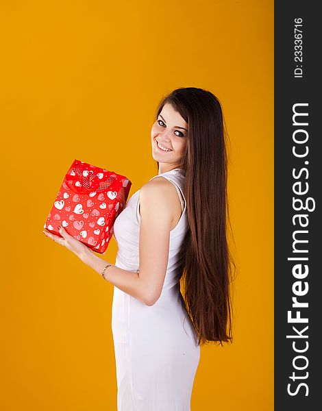 Woman In White Dress With A Gift