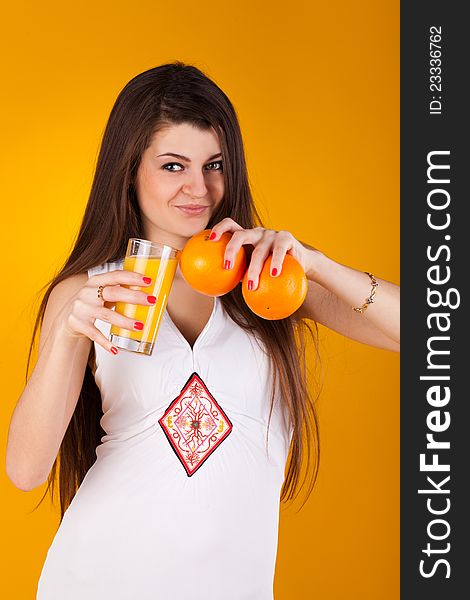 Pretty woman with juice an orange. Pretty woman with juice an orange