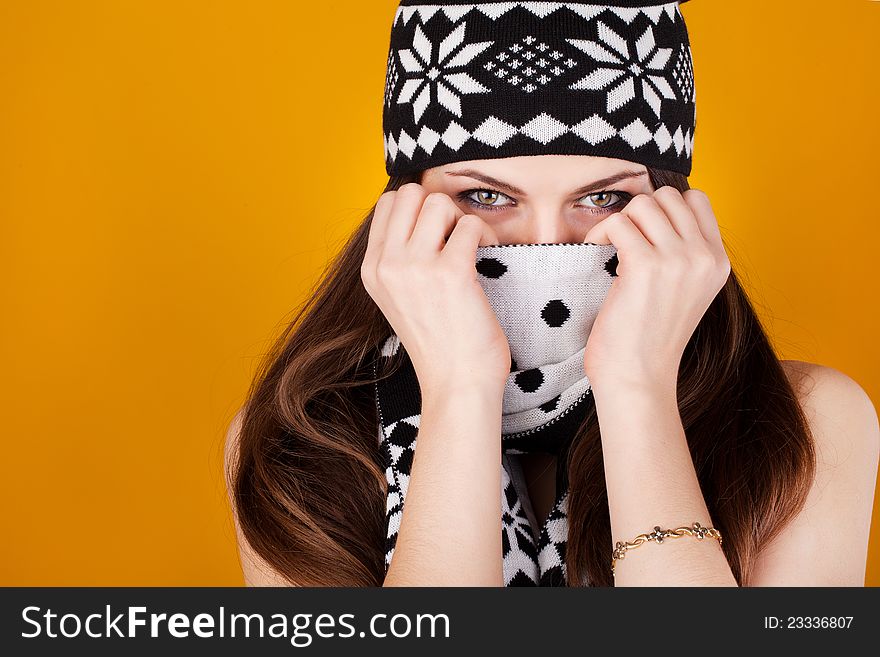 Young casual woman style in scarf and cap