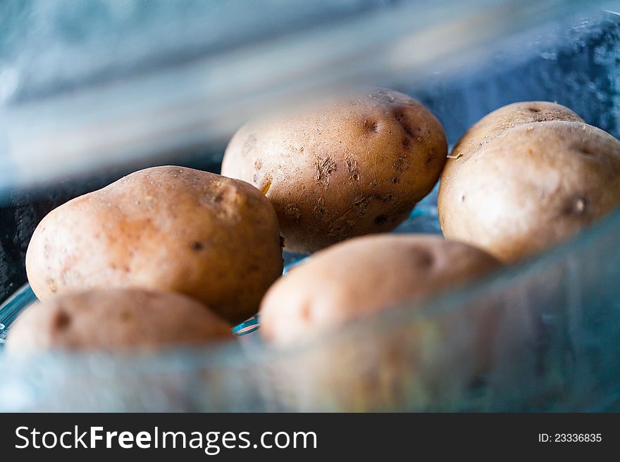 Fresh potatoes in electric steamer closeup. Fresh potatoes in electric steamer closeup