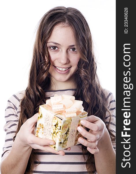 Girl holding a gift in packing. Girl holding a gift in packing