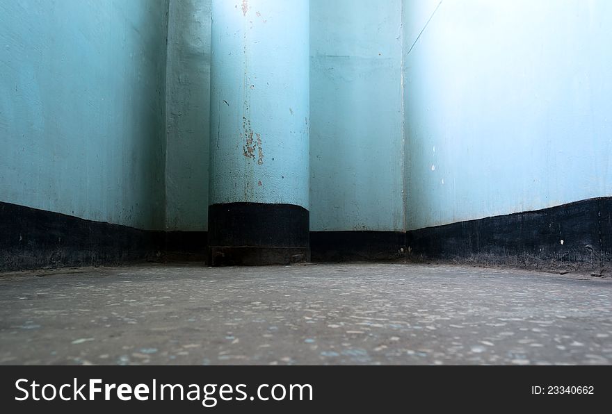 Old gloomy interior with dirty blue column. Old gloomy interior with dirty blue column