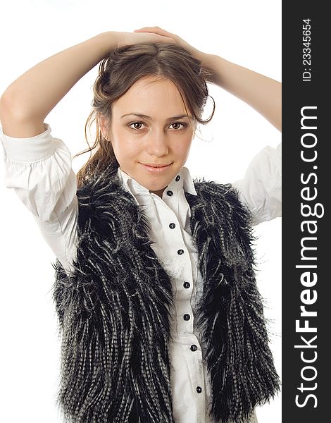 Girl in a fur vest posing isolated on white background. Girl in a fur vest posing isolated on white background