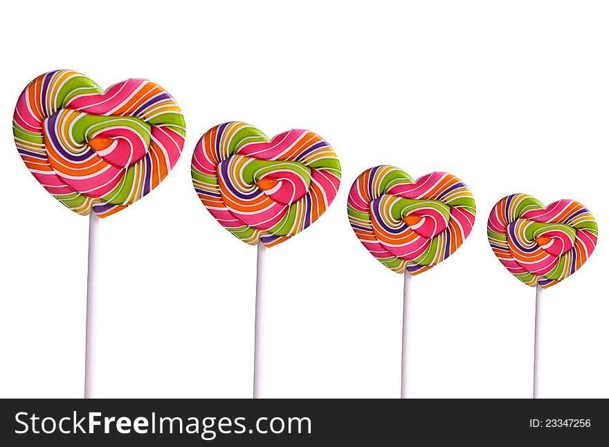 Colorful heart-shaped lollipops on white background. Colorful heart-shaped lollipops on white background
