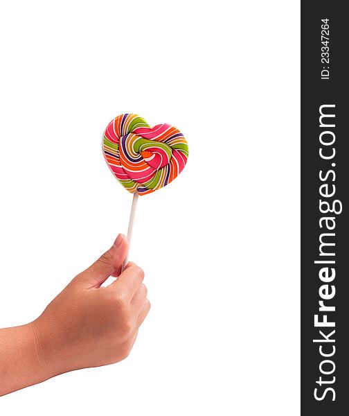 Hand holding heart-shaped lollipops colorful on white background. Hand holding heart-shaped lollipops colorful on white background