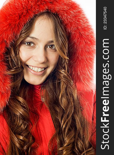 Portrait of a beautiful, smiling girl dress red fur coat. Portrait of a beautiful, smiling girl dress red fur coat