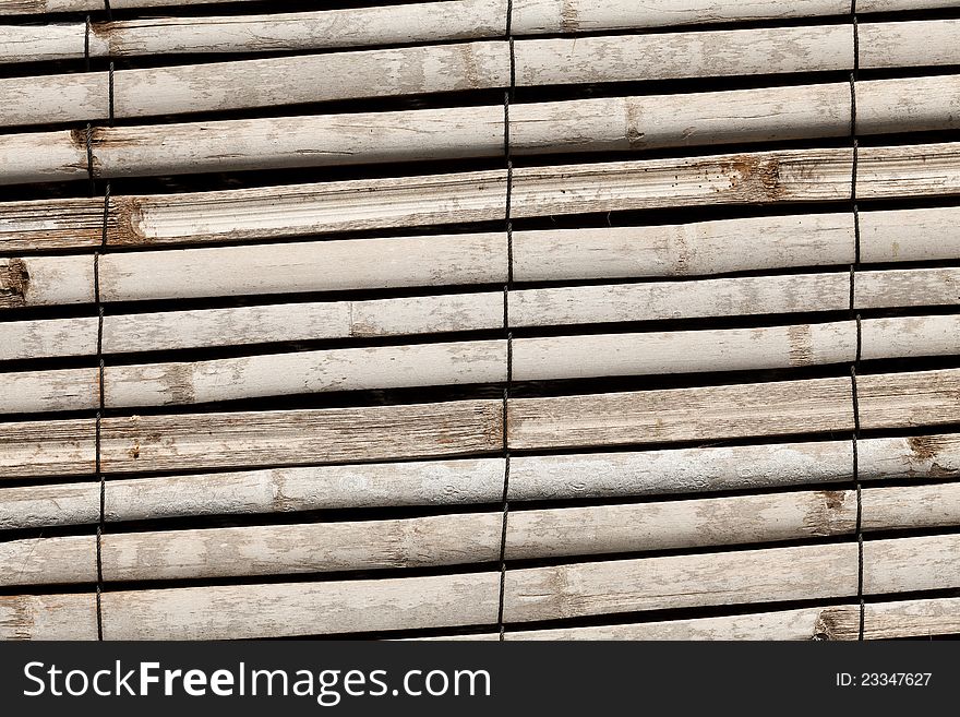 Wall from the tied up wooden planks