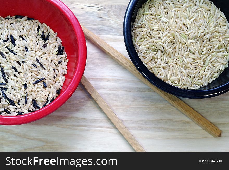 Basmati rice in Red and Black rice bowls with Chopsticks. Basmati rice in Red and Black rice bowls with Chopsticks