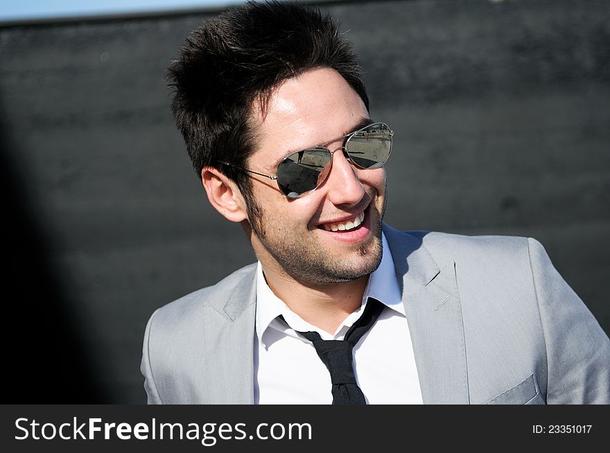 Attractive young businessman smiling