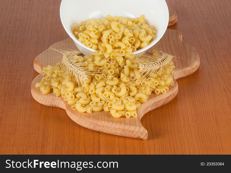 Dry wheat noodles with spikelets on the kitchen chalkboard