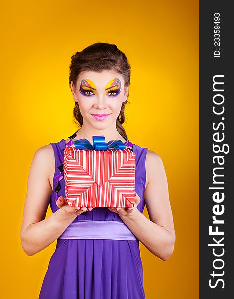 Beautiful Woman With Make Up In Dress With A Gift