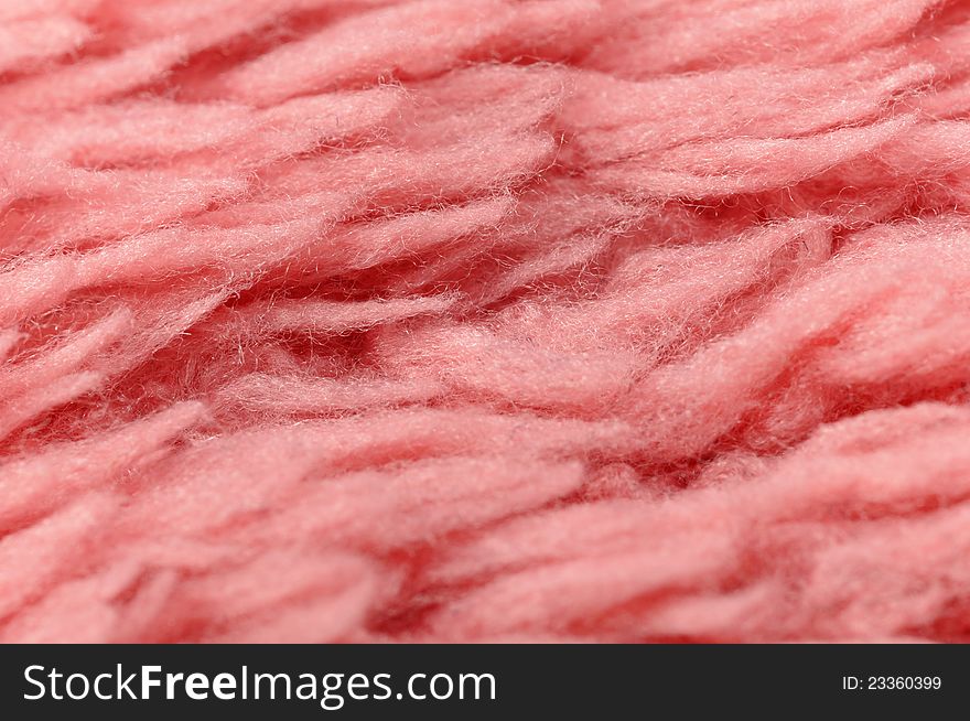 A fluffy pink cloth texture close-up