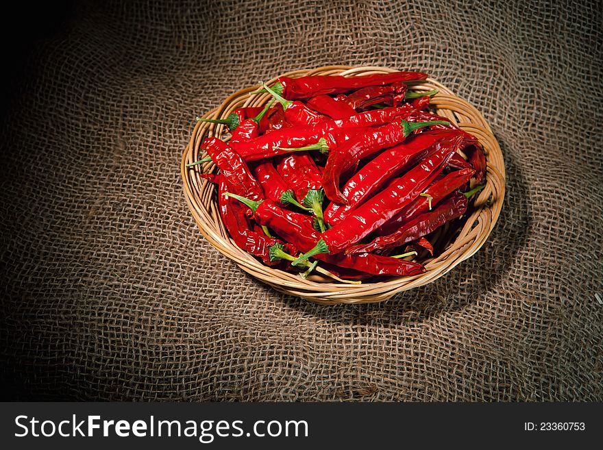 Red chili peppers on the wicker dish