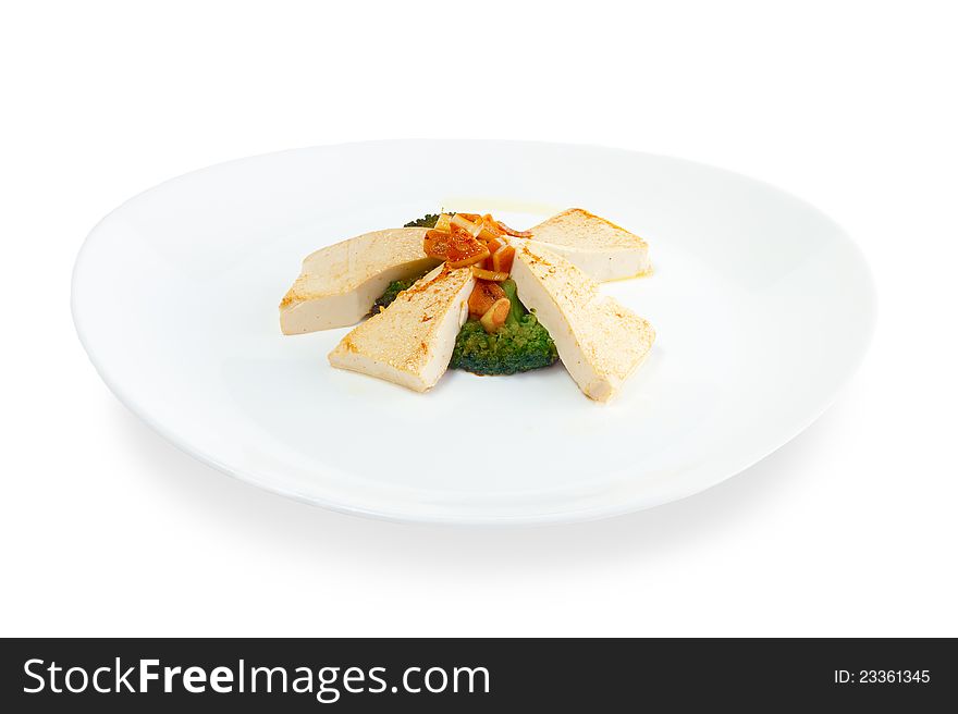 Slices of fried cheese with grilled vegetables on a white background