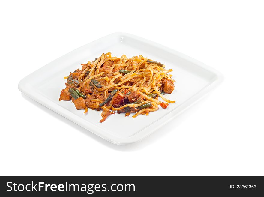 Spaghetti with a string bean and meat on a white background