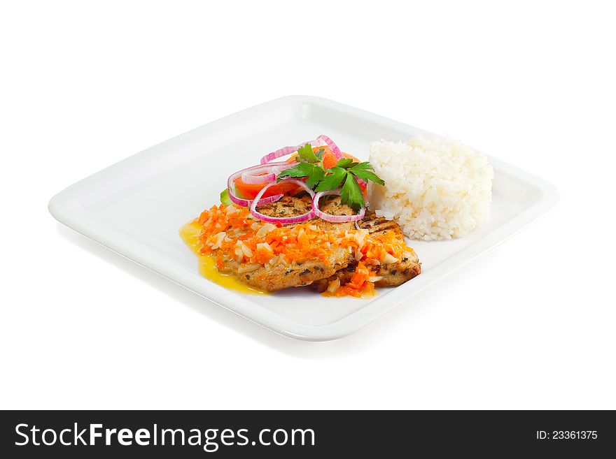 Rice with meat, vegetables and sauce on a white background