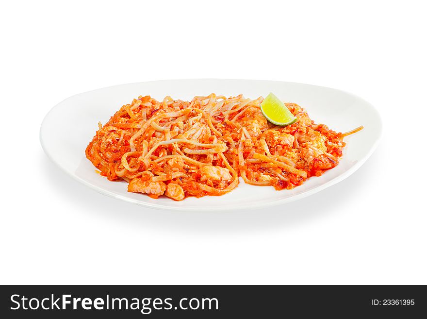 Spaghetti with seafood and tomato sauce on a white background