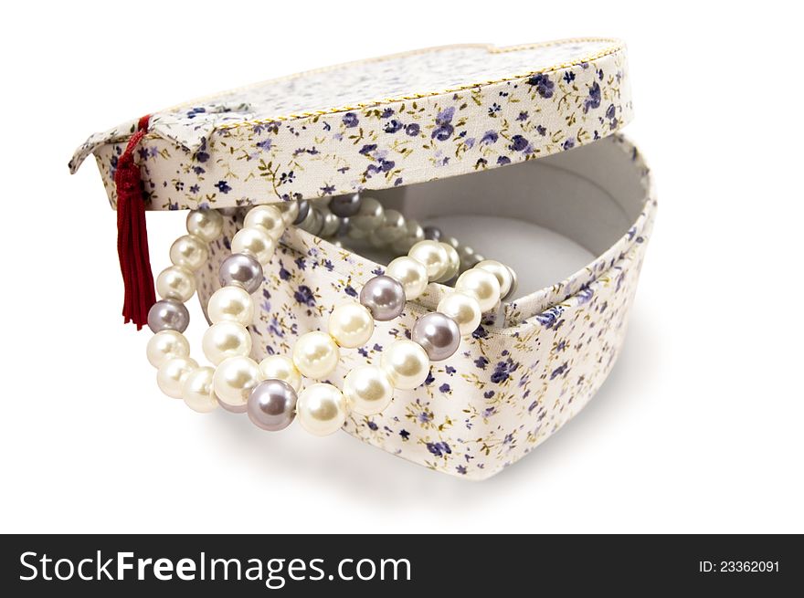 Giftbox with pearls on a white background