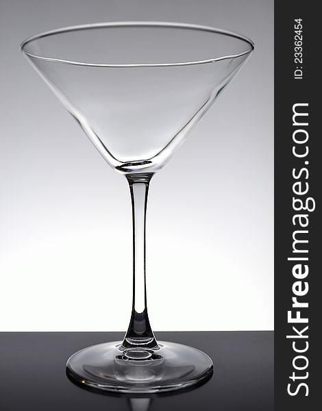 Empty martini glass on black table. Empty martini glass on black table