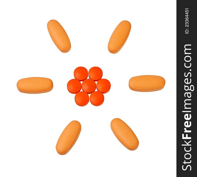 Orange pills in circular pattern isolated over white background. Orange pills in circular pattern isolated over white background.