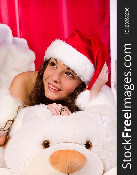 Beautiful girl near christmas tree with white bear. Beautiful girl near christmas tree with white bear