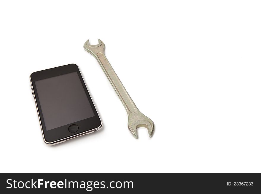 Cell phone with wrench on white isolated background. Cell phone with wrench on white isolated background