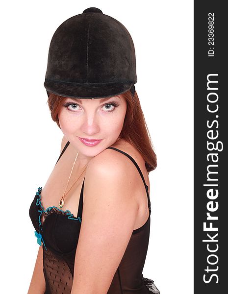 young woman in black lingerie in cap for the rider over white background. young woman in black lingerie in cap for the rider over white background