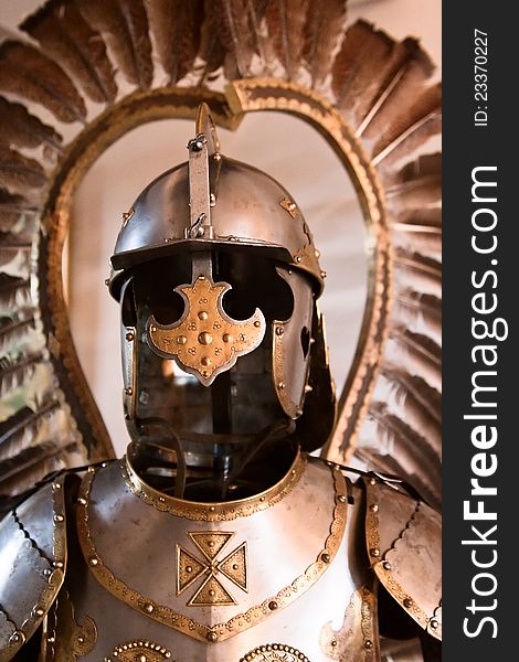 Ancient armor with feathers around the helmet