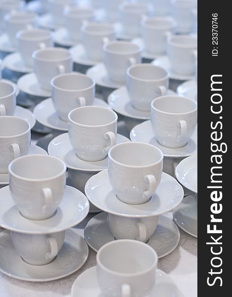 Many rows of pure white cup and saucer. Many rows of pure white cup and saucer