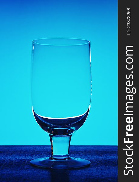 Glass for wine on a dark blue background