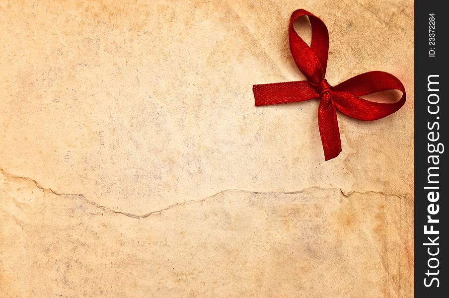 Retro brown paper with red bow. Retro brown paper with red bow