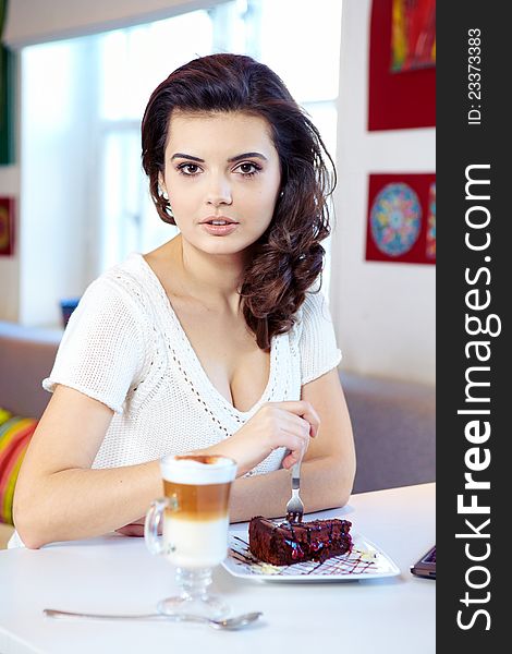 Student woman hold cake at cafe