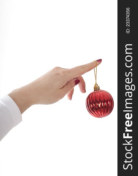 Female hands hold fur-tree spheres on a white background