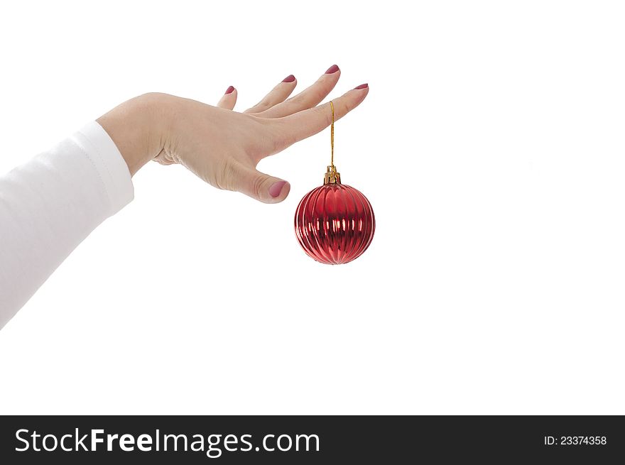 Female hands hold fur-tree spheres on a white background