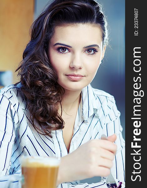 Beautiful young college student on a cafe.