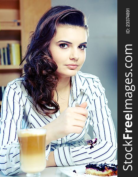 Beautiful young college student on a cafe.