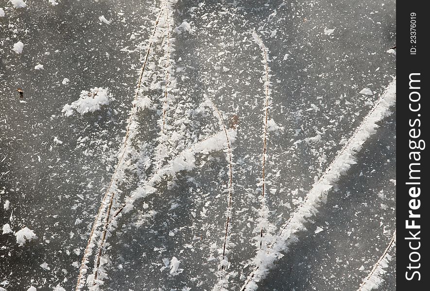 Snowflakes over ice and rods