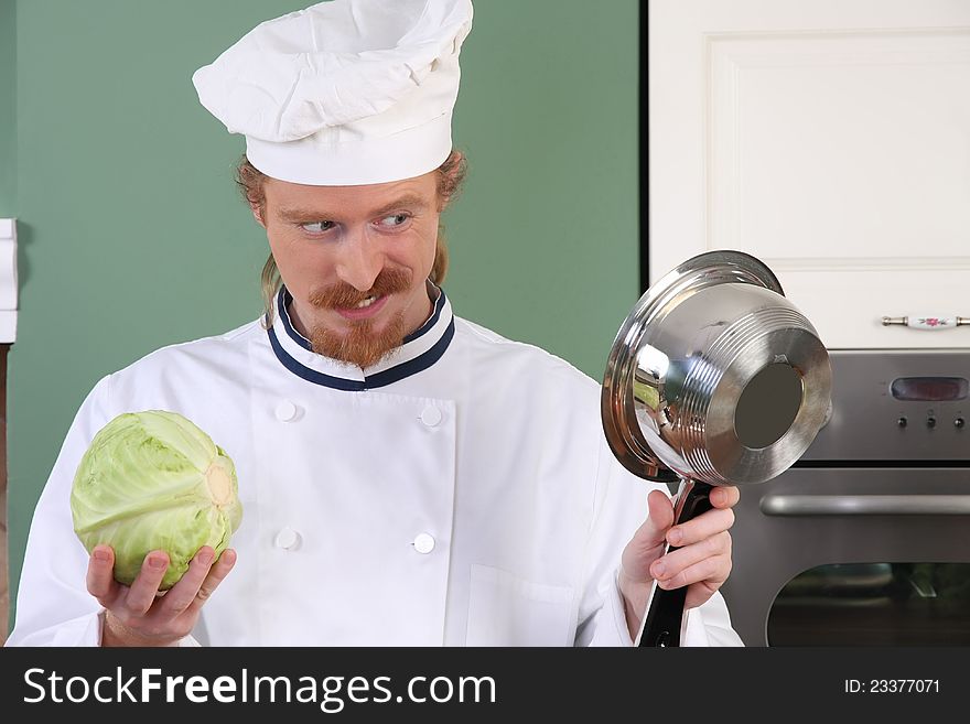 Young Chef Preparing Lunch In Kitchen