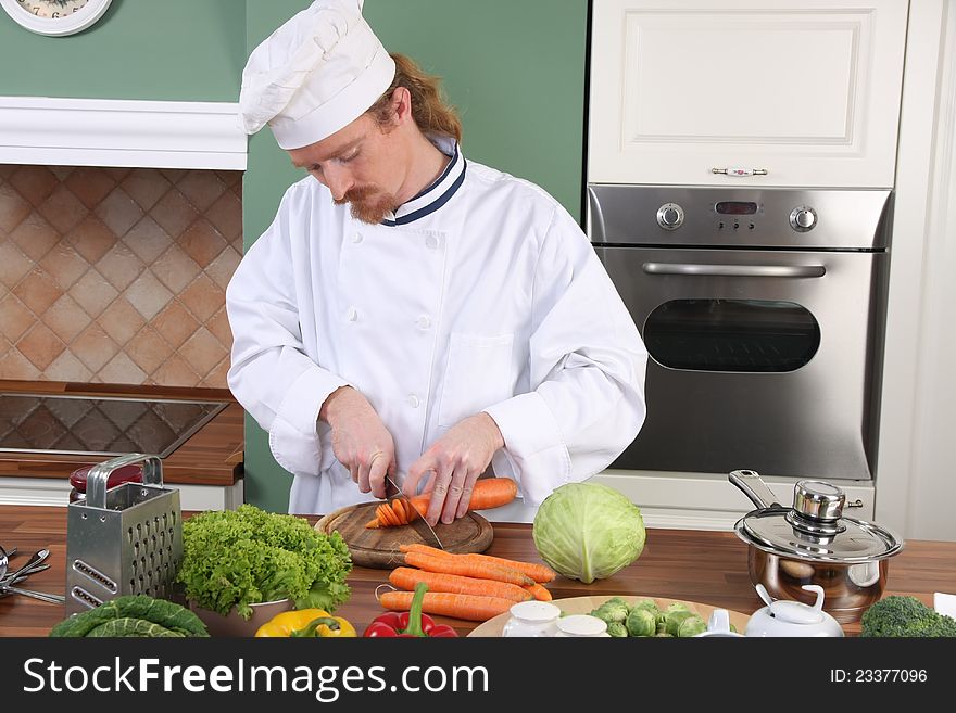 Young Chef Preparing Lunch In Kitchen