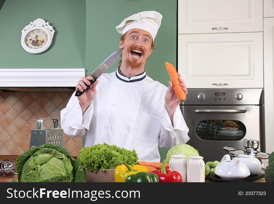 Funny Young Chef Preparing Lunch In Kitchen