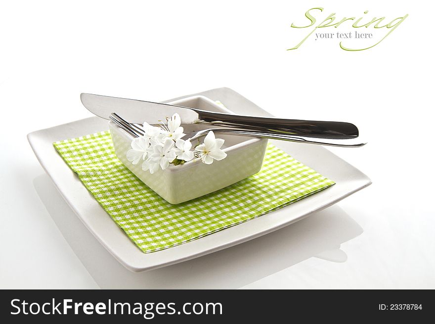 Spring table setting on white with space for text