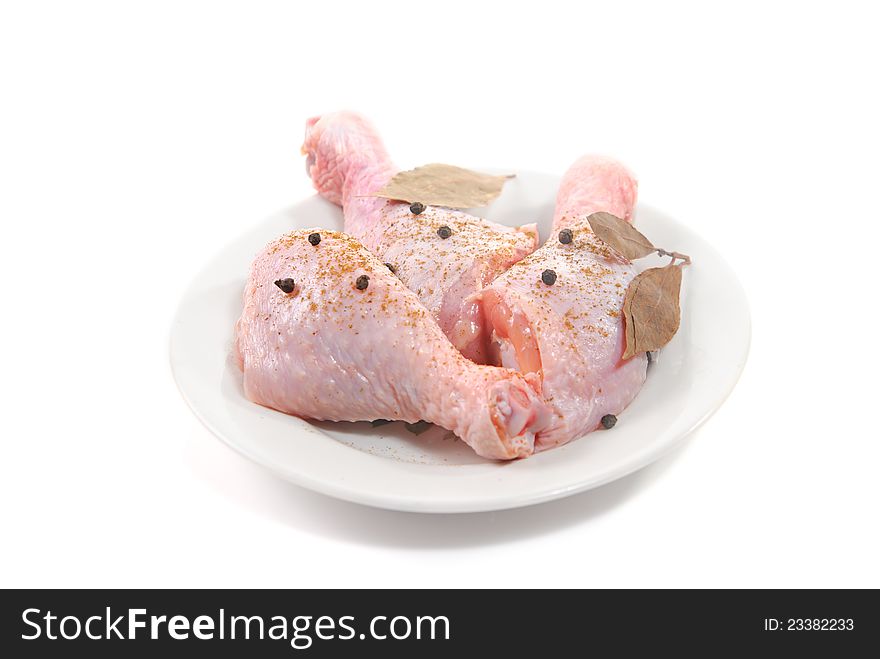 Three fresh raw chicken legs