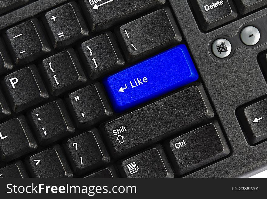 Close up of black pc keyboard, focus on blue like key, like concept. Close up of black pc keyboard, focus on blue like key, like concept