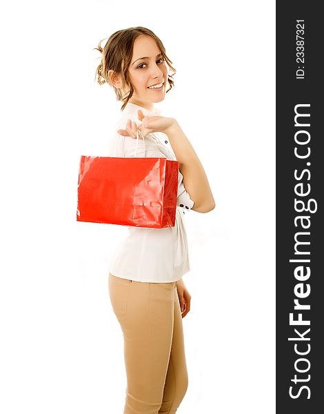 Girl going home carrying shopping bags on her shoulder with happy expression. Girl going home carrying shopping bags on her shoulder with happy expression