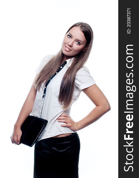 Portrait of a beautiful young woman holding a closed laptop isolated on white background