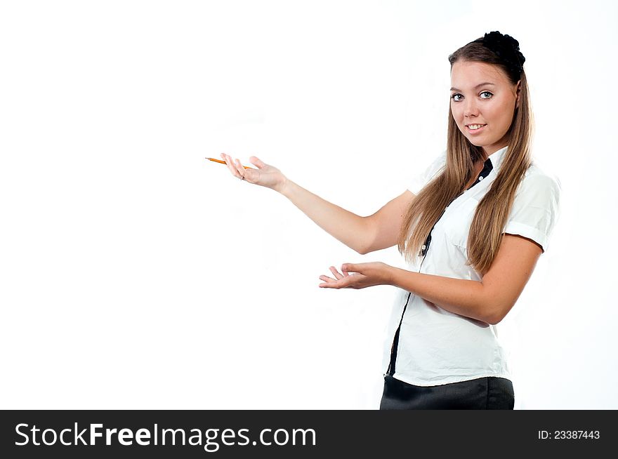 Portrait of a beautiful young woman holding pencil and showing an empty space isolated on white background. Portrait of a beautiful young woman holding pencil and showing an empty space isolated on white background