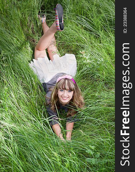 Beautiful Girl On Green Grass