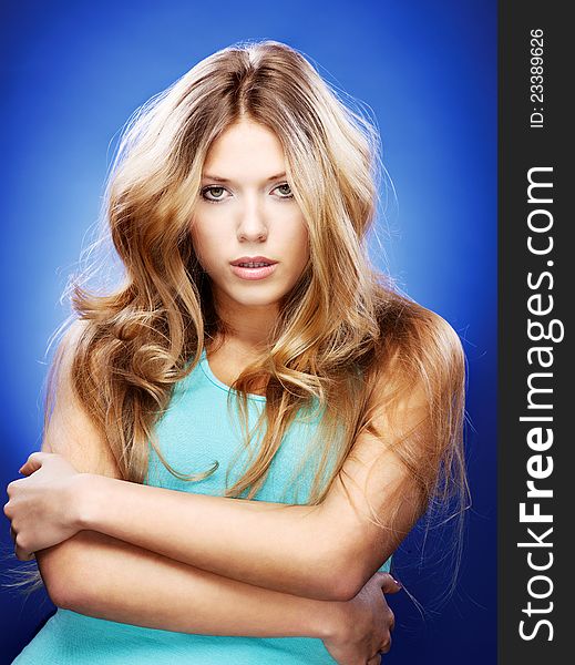 Blond woman on blue background